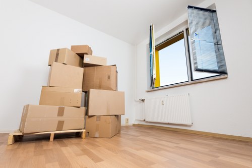 Professional movers handling furniture in Brompton